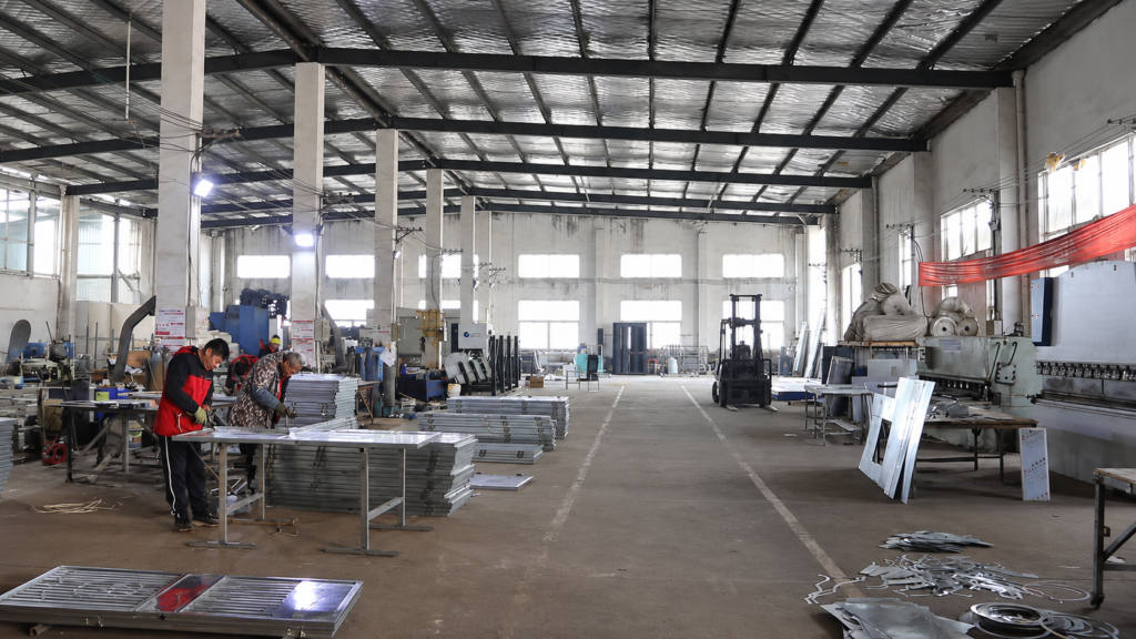 Yubang Outdoor production workshop with metal processing equipment and assembly areas.